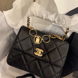 Chanel Mini Charms Flap Bag Black Lambskin
NWT, Brushed Gold Hardware